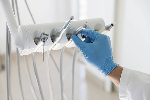 Professional Tooth Extraction technician working in Laton, CA